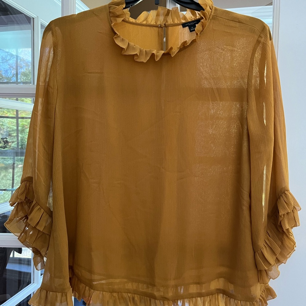 Beautiful blouse used twice. Color mustard.
